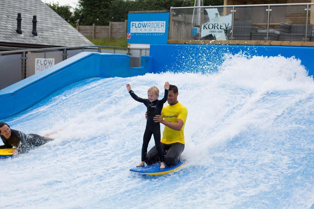 Retallack Resort & Spa Padstow Exterior foto A child learning to surf on the FlowRider